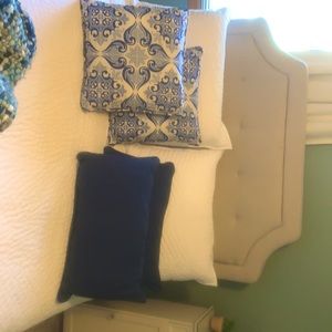 Set of 4 outdoor pillows- 2 solid blue, 2 print blue and cream.